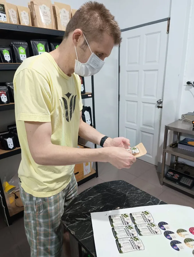 Applying a sticker to the finished pouch